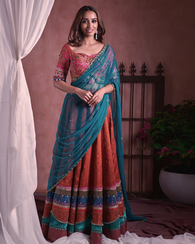 Multicolored border lehanga with tasselled tulle dupatta and zardosi heavy embroidered blouse