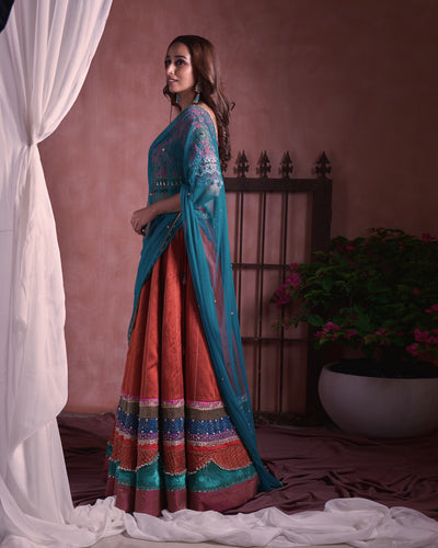 Multicolored border lehanga with tasselled tulle dupatta and zardosi heavy embroidered blouse