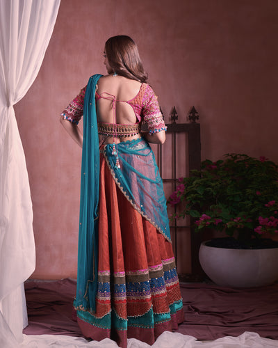 Multicolored border lehanga with tasselled tulle dupatta and zardosi heavy embroidered blouse