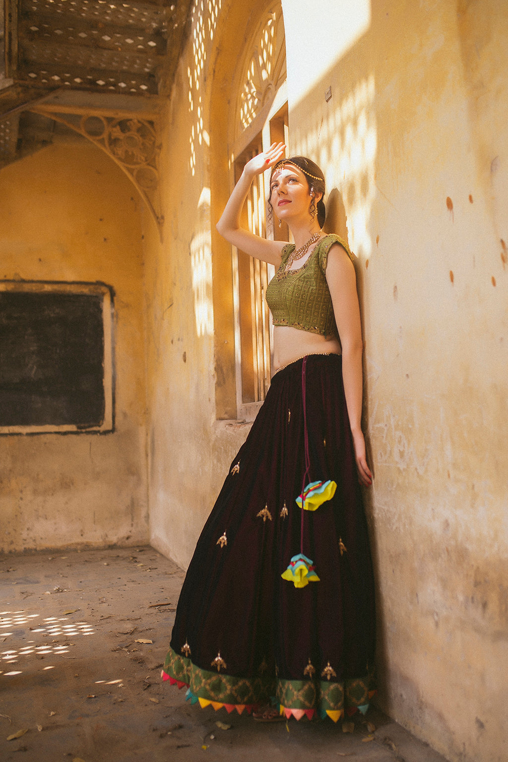 Wine velvet panelled lehenga with multicolor border detail ,with cap sleeve green blouse and mustard tulle dupatta