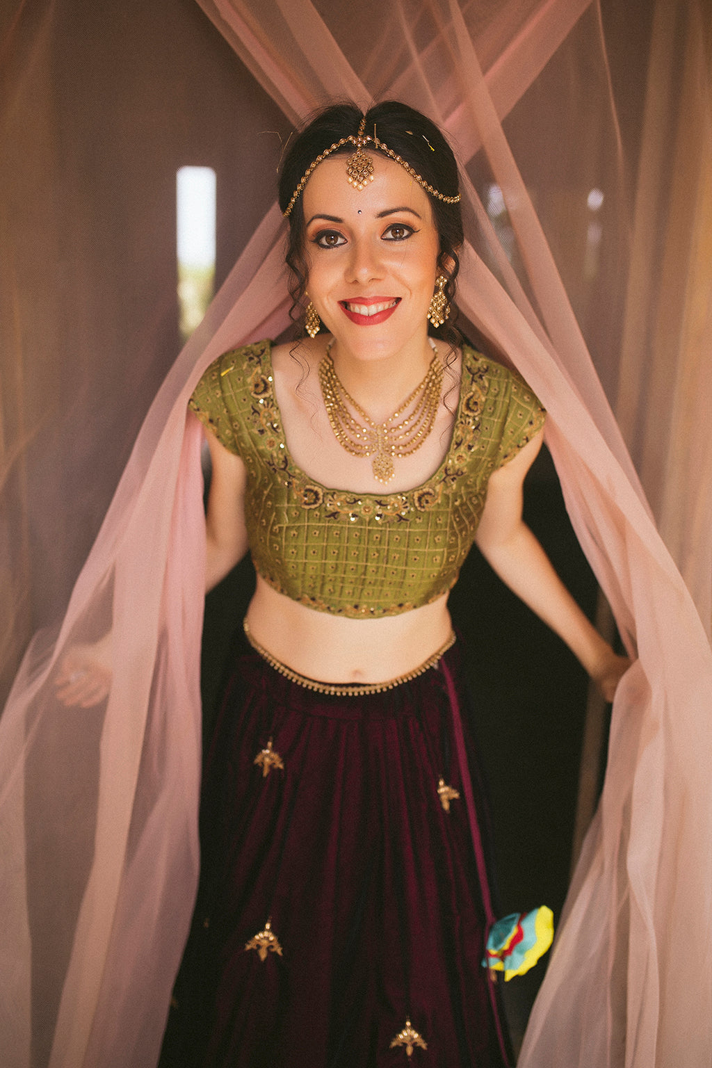 Wine velvet panelled lehenga with multicolor border detail ,with cap sleeve green blouse and mustard tulle dupatta