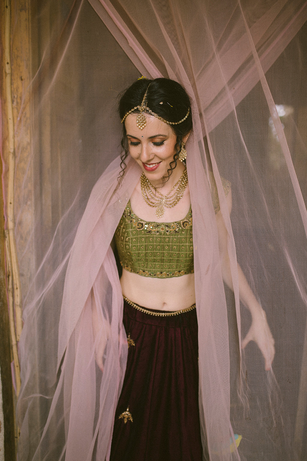 Wine velvet panelled lehenga with multicolor border detail ,with cap sleeve green blouse and mustard tulle dupatta
