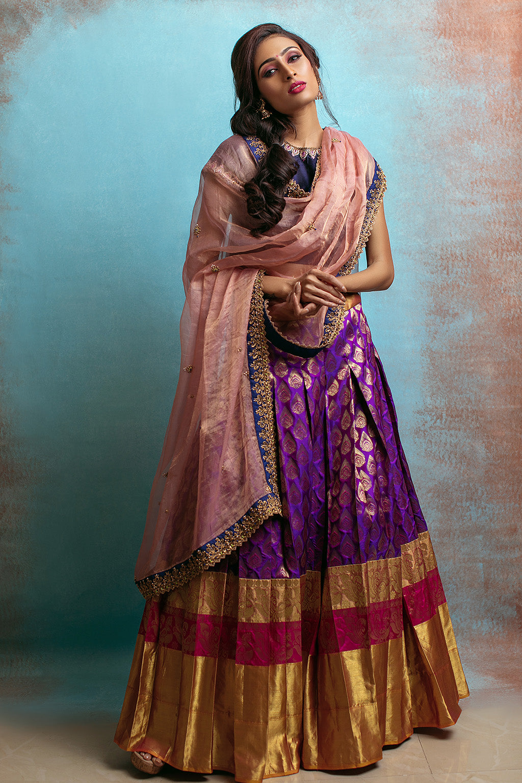 High neck blouse with purple kanchi skirt and tissue blush dupatta