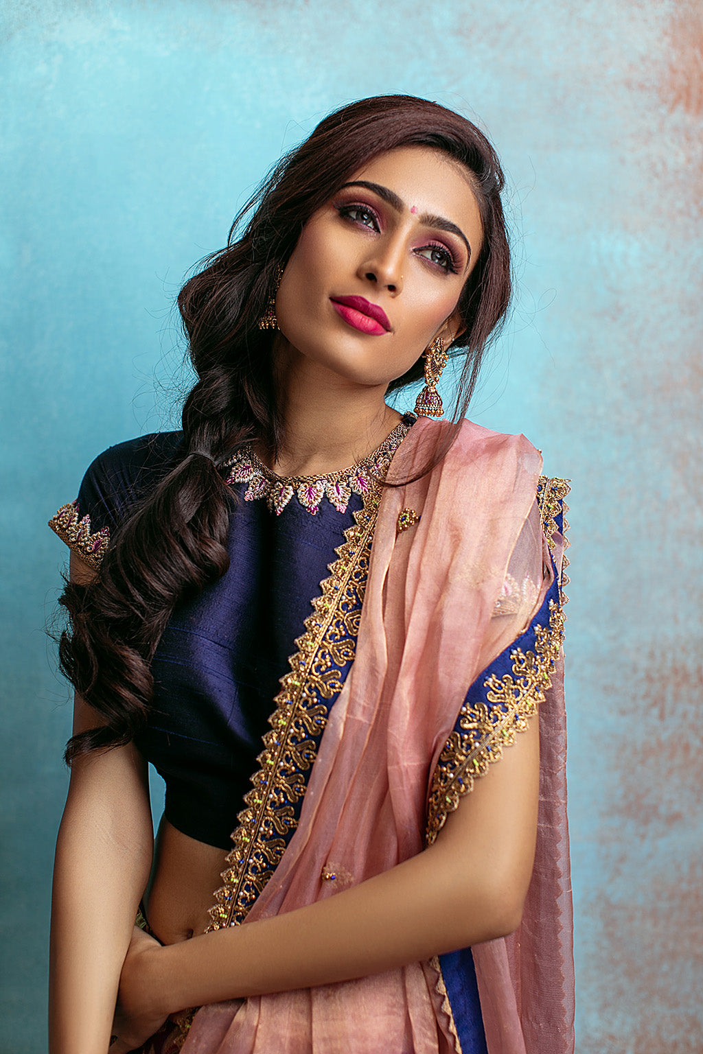 High neck blouse with purple kanchi skirt and tissue blush dupatta