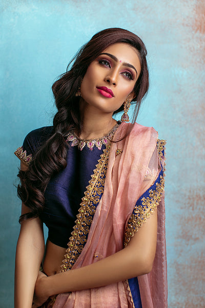 High neck blouse with purple kanchi skirt and tissue blush dupatta