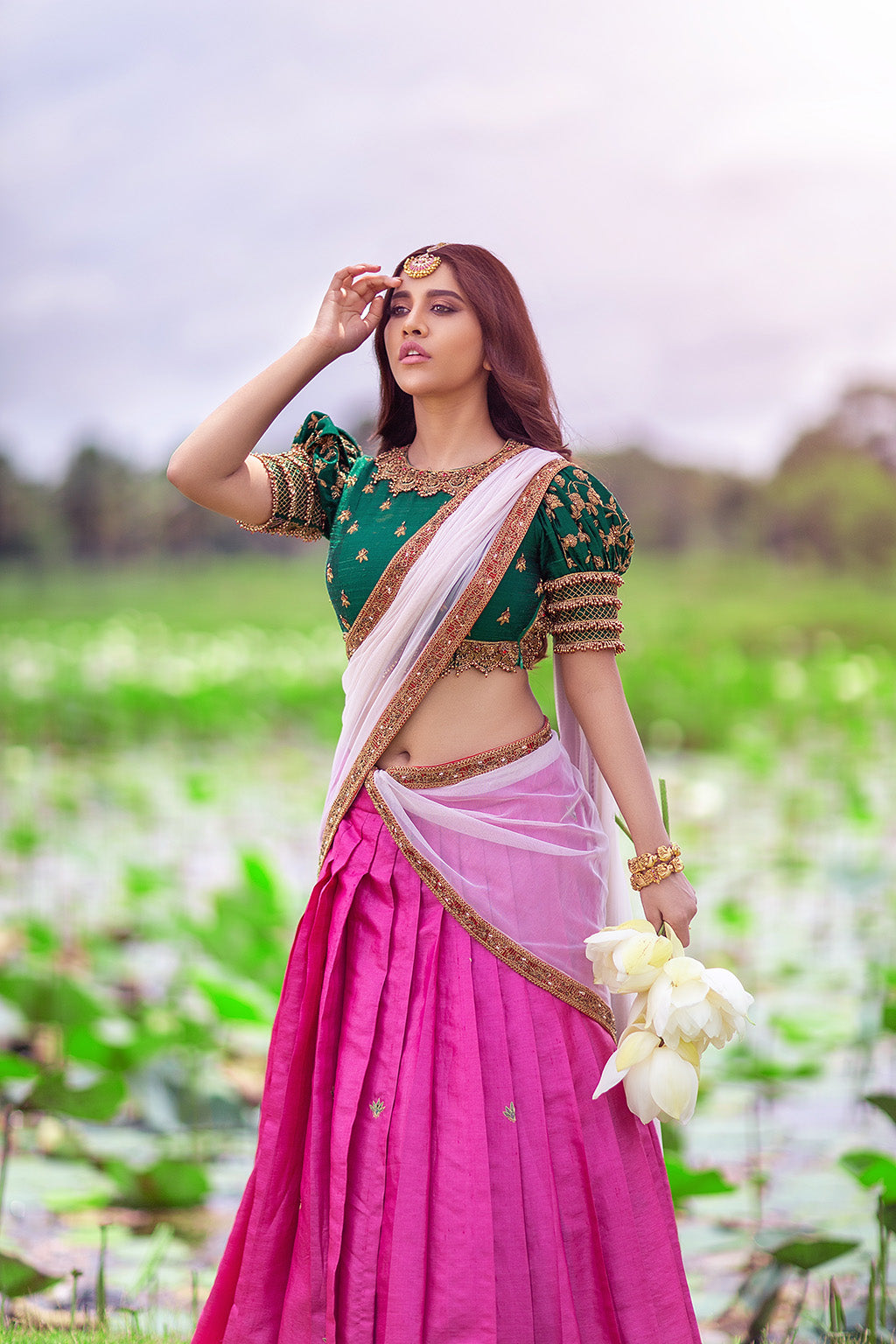 Puff sleeve high neck jewel blouse with pink tussar silk pleated skirt and beige tulle dupatta