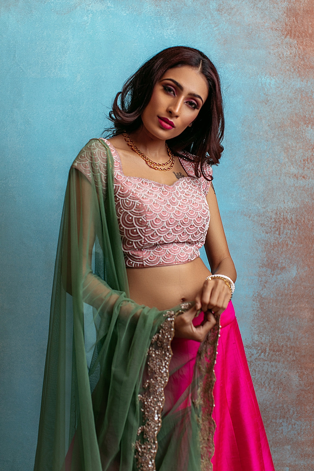 Scallop pearl embellished  blouse,panelled lehenga with floral work and tulle dupatta