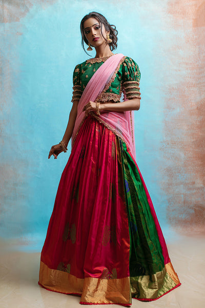 Puff sleeve high neck jewel blouse with red and green draped silk skirt and tulle dupatta