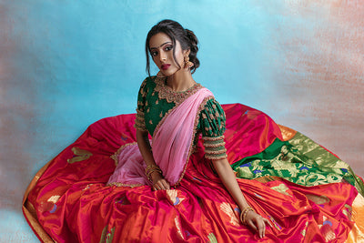 Puff sleeve high neck jewel blouse with red and green draped silk skirt and tulle dupatta